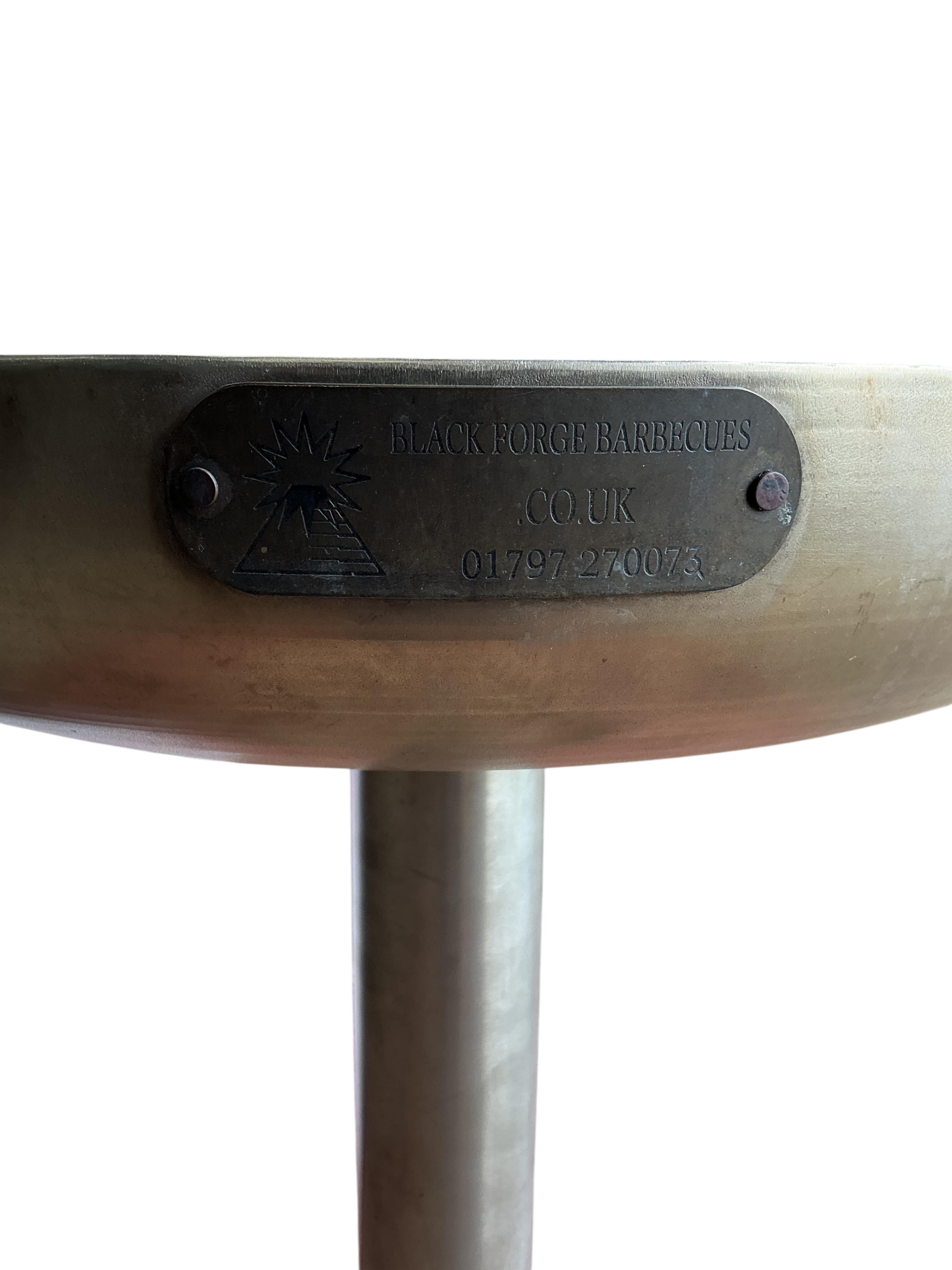 A Black Forge 'Mini Ikon' stainless steel barbecue, height 96cm